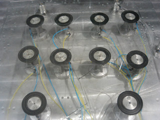 Suction Cups Mounted on Working Table with Well Connected Vacuum Hoses